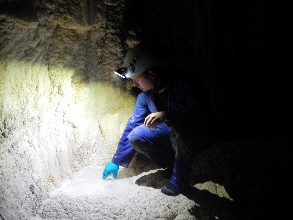 A scientist in a cave